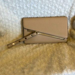 Brand new beige clutch with gold trim and studs